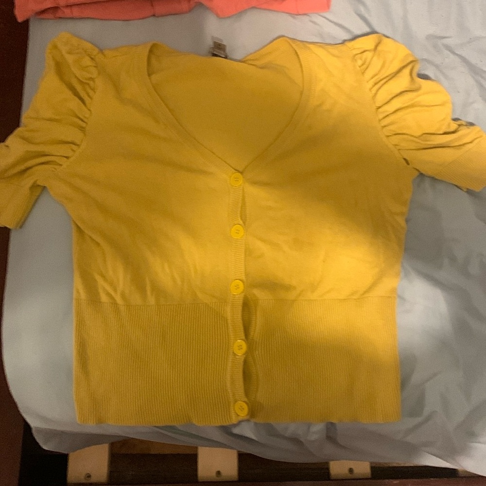 Yellow, cropped shirt, Medium with a small rip in the sleeve area.
